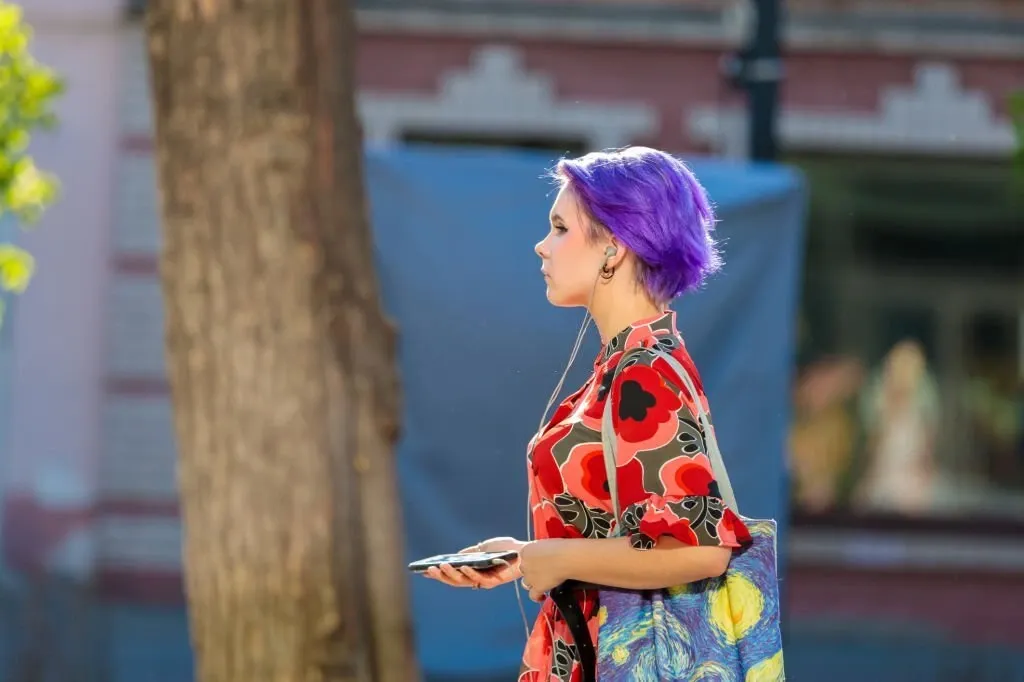 Pixie Haircut with Purple Highlights on Dark Hair 